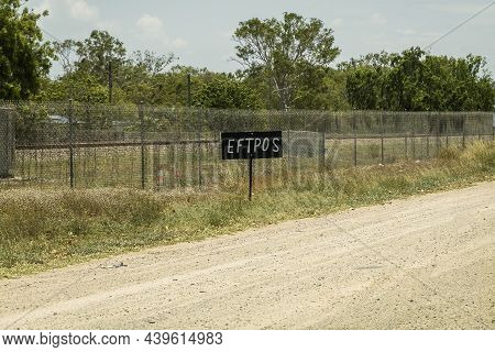 Sign On Side Of The Road Advertising Eftpos Card Facilities At An Approaching Shop
