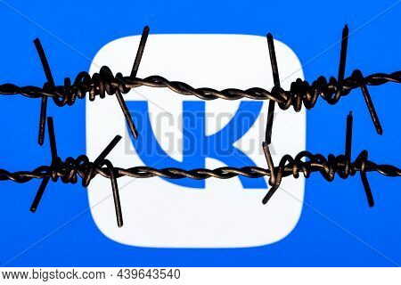 Kazan, Russia - Nov 13, 2021: Vkontakte Social Network Logo Behind Barbed Wire. The Concept Of Vkont