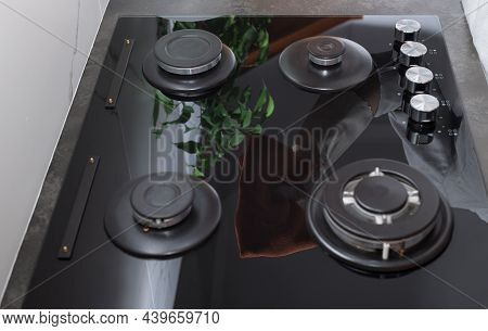 Clean Shiny Gas Stove Top With Rag Reflection. Kitchen Cleaning And Hygiene Concept. Top View. Selec