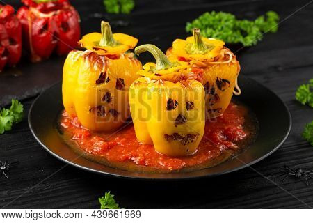 Jack O Lanterns Stuffed Yellow Pepper For Halloween.