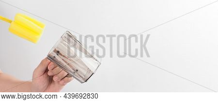 Clean And Wash Dish Concept. Man Hand Washing Drink Glass On White Background.