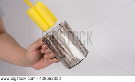 Clean And Wash Dish Concept. Man Hand Washing Drink Glass On White Background.