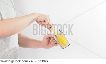 Clean And Wash Dish Concept. Man Hand Washing Drink Glass On White Background.