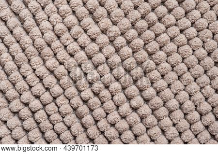 The Repetitive Pattern Of A Bathroom Rug. Thick Fluffy Microfiber Floor Mat From Chenille Fabric