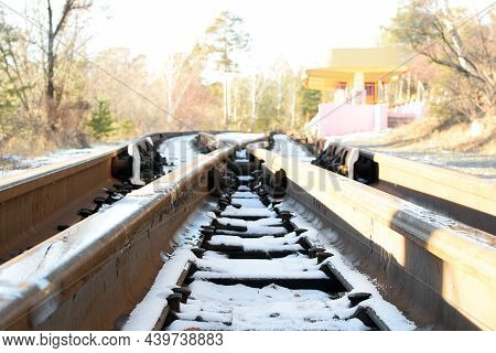Railroad And Railway Platform In The Winter Forest, Defocused.
