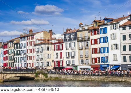 Bayonne, France - October 17, 2021: Paople On The Quay Of The Nive River In Bayonne, France