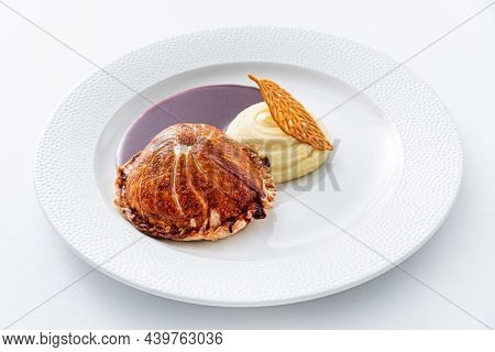 Tenderloin with pork, mushrooms and sirloin puff pastry on a white background. Homemade meal for wellington.