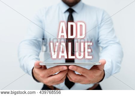 Hand Writing Sign Add Value. Conceptual Photo An Improvement Or Addition To Something That Makes It 