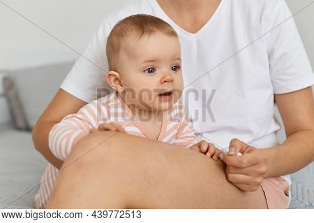 Indoor Shot Of Faceless Unknown Woman Wearing White T Shirt And Shorts And Cute Charming Infant Baby