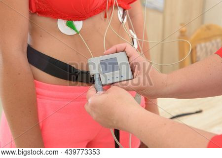 Electrocardiography Ecg Leads For A Portable Heart Monitor On An Young Woman Patient. The Nurse Conn
