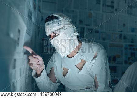 Victim Of Tabloid Journalism And Fake News Infodemic, Conceptual Image Of Man Wrapped In Bandages Su