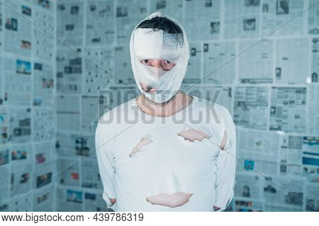 Victim Of Tabloid Journalism And Fake News Infodemic, Conceptual Image Of Man Wrapped In Bandages Su