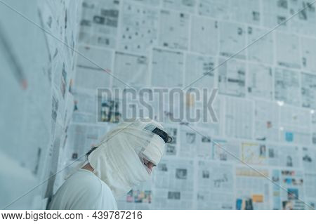 Victim Of Tabloid Journalism And Fake News Infodemic, Conceptual Image Of Man Wrapped In Bandages Su