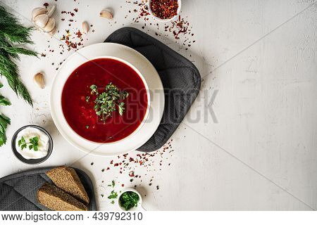 Traditional Ukrainian Russian Borscht On A Light Background. Borscht With Sour Cream. Beetroot Borsc