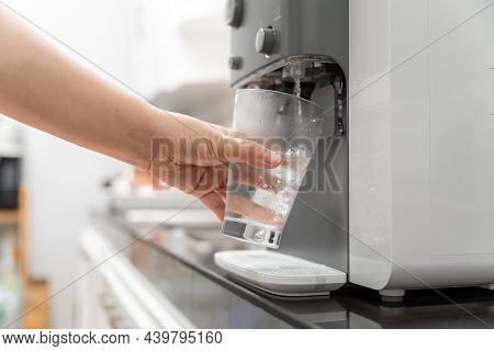 Close-up Hand Of Woman Drinking Water Is Poured From Water Cooler Into The Glass, Drinking Water Mac