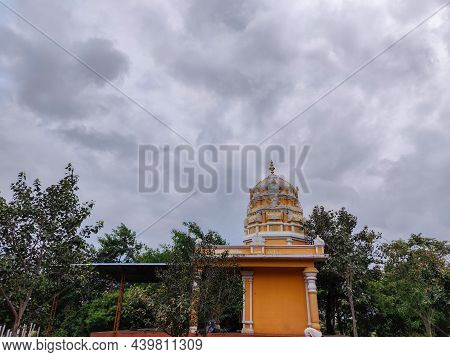 Stock Photo Of Beautiful Lord Shiva Temple Painted With Light Orange And White Color On Intricate Ca
