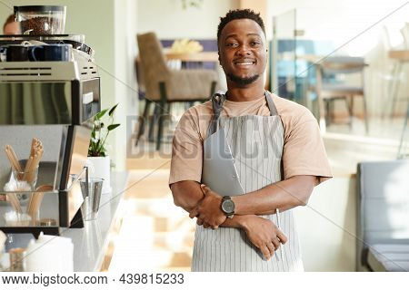 Horizontal Medium Portrait Of Joyful African American Man Wearing Apron Working In Cafe Holding Pen 