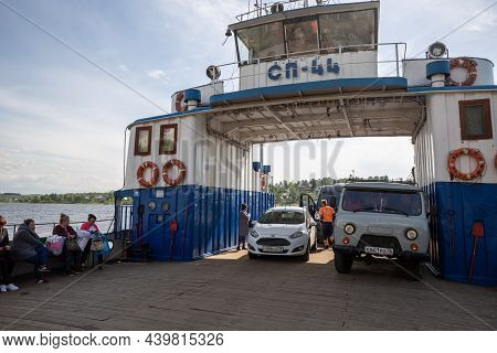 Tutaev, Yaroslavl Region, Russia - May 15, 2019: Ferry Crossing The Volga River. Cars And Passengers