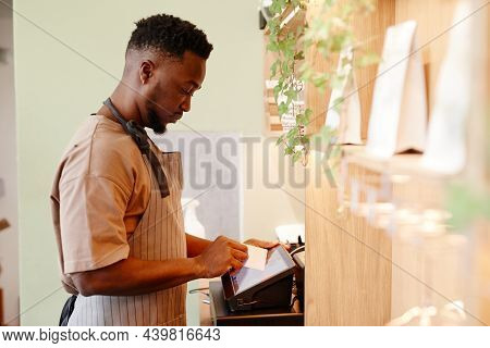 Horizontal Side View Shot Of Modern Small Cafe Worker Working With Customer Taking Order Using Cash 