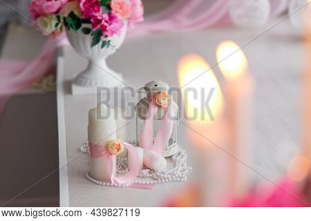 Beautiful Decor Of Candles And Flowers. White Pink Shades.