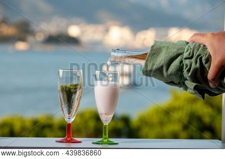 Summer Party, Pouring Of French Champagne Sparkling Wine In Glasses With View On Fishermen Harbour O