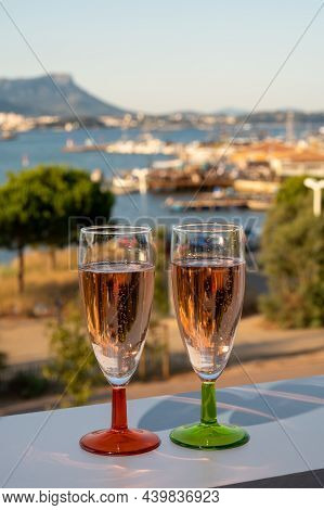 Summer Party, Drinking Of French Champagne Rose Sparkling Wine In Glasses With View On Fishermen Har