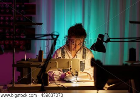 Tailor Self-employment: Young Woman Work On Sewing Machine In Little Creative Atelier Creating Bespo