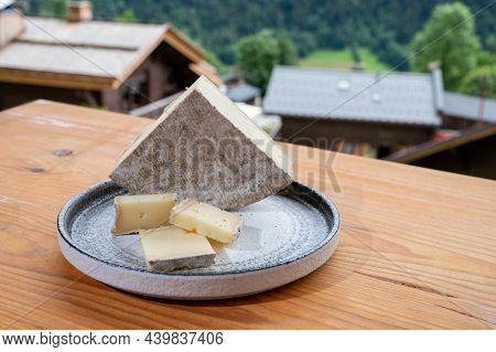 Cheese Collection, French Cheese Tomme De Savoie And French Mountains Village In Haute-savoie On Bac