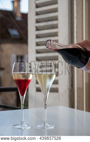 Drinking Of Kir Royal,  French Aperitif Cocktail Made  From Creme De Cassis Topped With Champagne, T