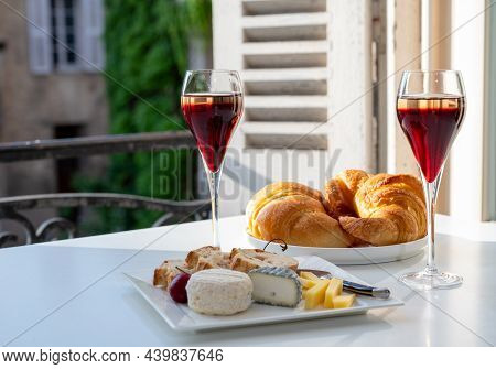 Drinking Of Kir Royal,  French Aperitif Cocktail Made  From Creme De Cassis Topped With Champagne, T