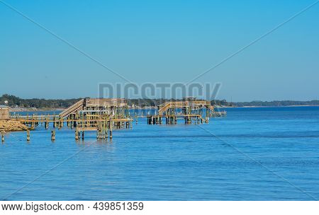 Docks Extending Out On Hammock Bay In Freeport, Walton County, Florida