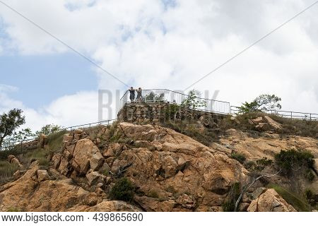 Townsville, Queensland, Australia - November 2021: Sightseers Looking Out From The Top Of Castle Hil