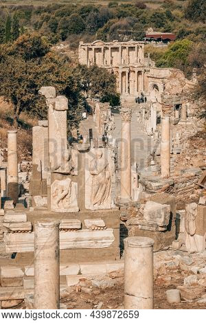 Ruins if the Ephesus ancient city in Selcuk, Turkey. Historic Curetes street, Hadrian temple, Library of Celsus and other famous ruins in Ephesus UNESCO World Heritage site.