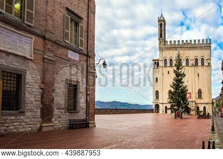 Piazza Grande is the city center. Consular palace. The antique city of Gubbio with a rich history and grandiose architecture. The city is located in the Umbrian mountains. Rainy day. Italy
