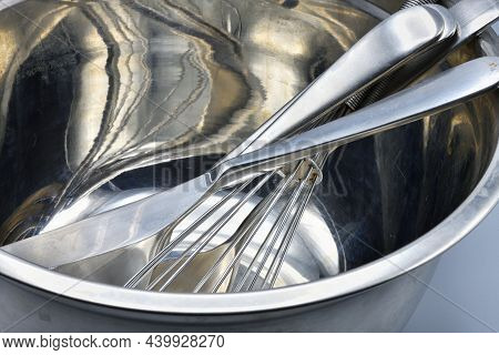 Stainless steel kitchen items used for cooking and preparing.