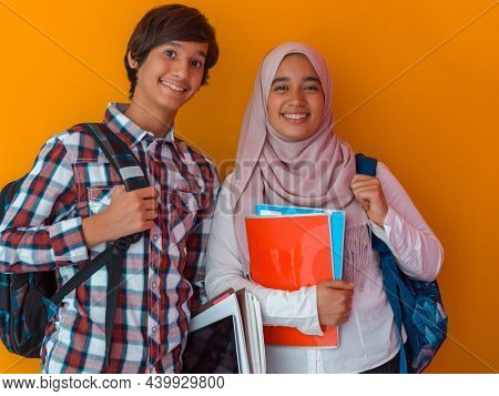 A group of Arab teenagers, a student team walking forward into the future and back to school the concept of a yellow background. The concept of successful education for young people. Selective focus