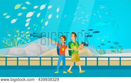 People Making Photo Of Underwater Scenery With Sea Animals In Aquarium. Oceanarium Visitors Look At 