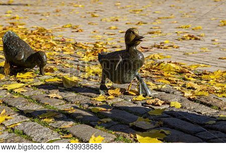 Monument To The Road Ducklings In The Park Novodevichy Ponds In Autumn--sculpture Of A Duck With Duc