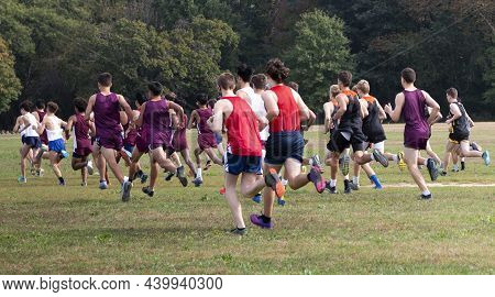 Rear View Of The Start Of A Boys High School Cross Country Race On A Grass Field At Van Cortlandt Pa