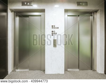 Two New Elevators In The Hotel. Material Is Stainless Steel. Between The Elevators There Are Floor S