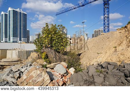 Photo Of The Construction Site Of Multi-storey Buildings And Cranes In The City.