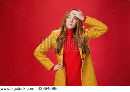 Girl Having Feaver Touching Forehead With Palm Looking Displeased And Bothered Left As Thinking She 