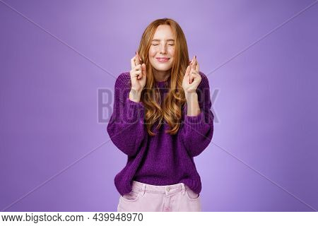Girl Makes Wish Eager Dream Come True. Atractive Hopeful And Positive Young Redhead Woman In Purple 