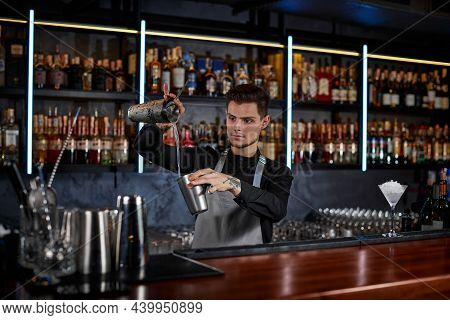 Barman Is Making Cocktail With Steel Shaker