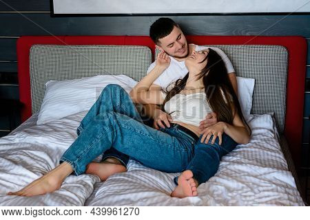 Pillow Fight In A Hotel Room, Rest Of A Young Couple, Advertising Of Hotel Rooms.