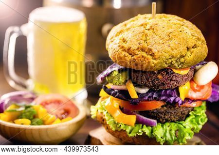 Vegan Burger On Wholemeal Bread With Cold Beer In The Background. Vegetarian Snack Without Meat And 