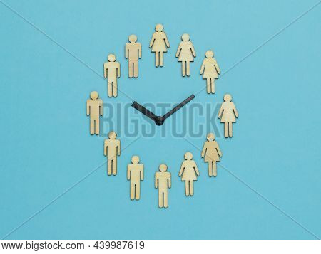 The Clock Is Half Of Female And Half Of Male Figures On A Blue Background. The Concept Of Periodic G