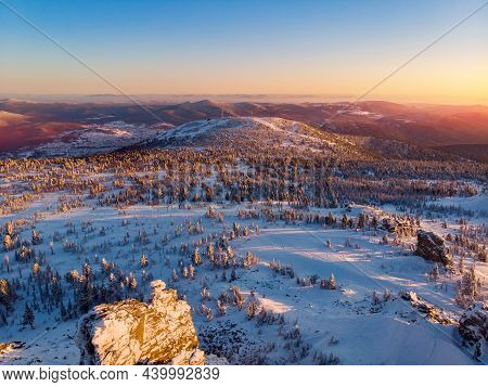 Colorful Winter Sunset In Sheregesh Ski Resort Mountains With Clouds. Aerial Top View Forest Russia