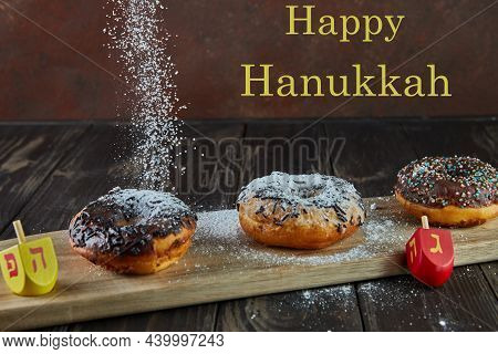 Happy Hanukkah And Hanukkah Sameach - Traditional Jewish Donuts, Spinning Tops With Pouring Powdered