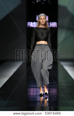 ZAGREB, CROATIA - OCTOBER 17: Fashion model wearing clothes designed by Petra Vuletic and Sasa Hortig on the 'Fashion.hr' show on October 17, 2013 in Zagreb, Croatia.